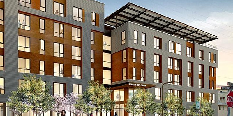 Rendering of the six-story Berkeley HOPE center. The center is a tall building taking up an entire block. There are solar panels on the roof and the sidewalk in front of it is lined in trees. The building is well lit, and it looks inviting.