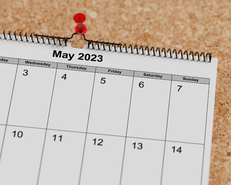 Picture of a calendar flipped to May 2023